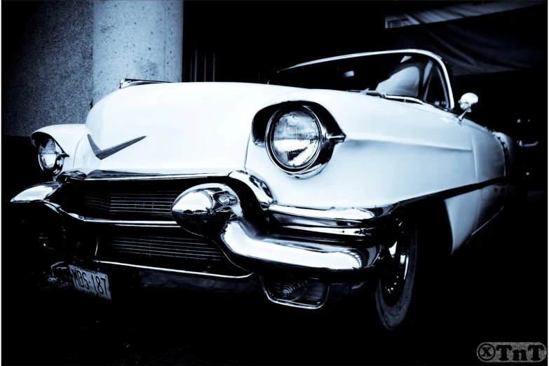 classic american car parked in front of a building