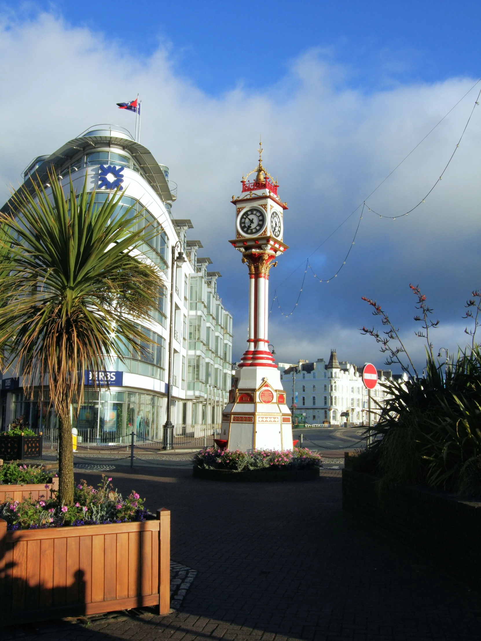 there is a clock tower in the middle of this street