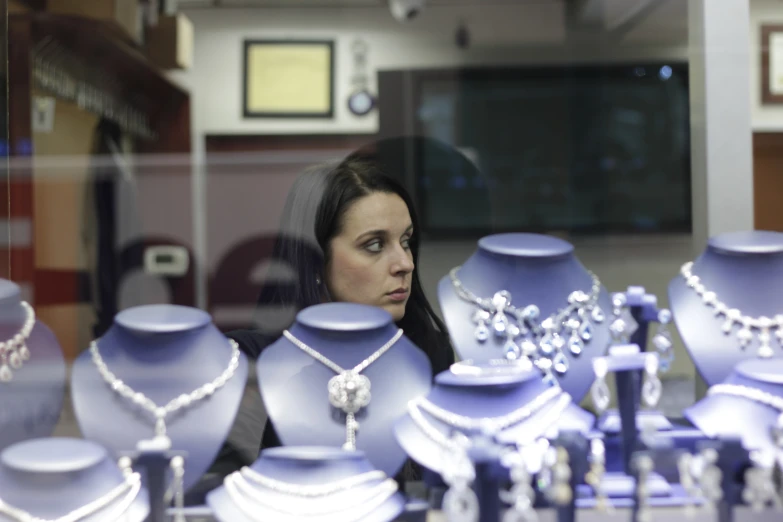 a women in front of a display of many fancy items