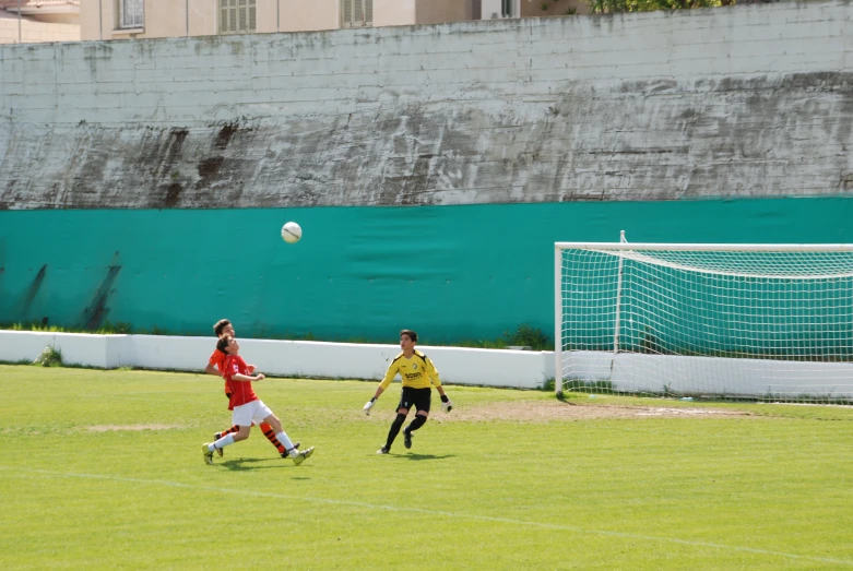 the young men are playing a game of soccer