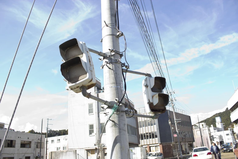 a group of street lights sitting on the side of a pole