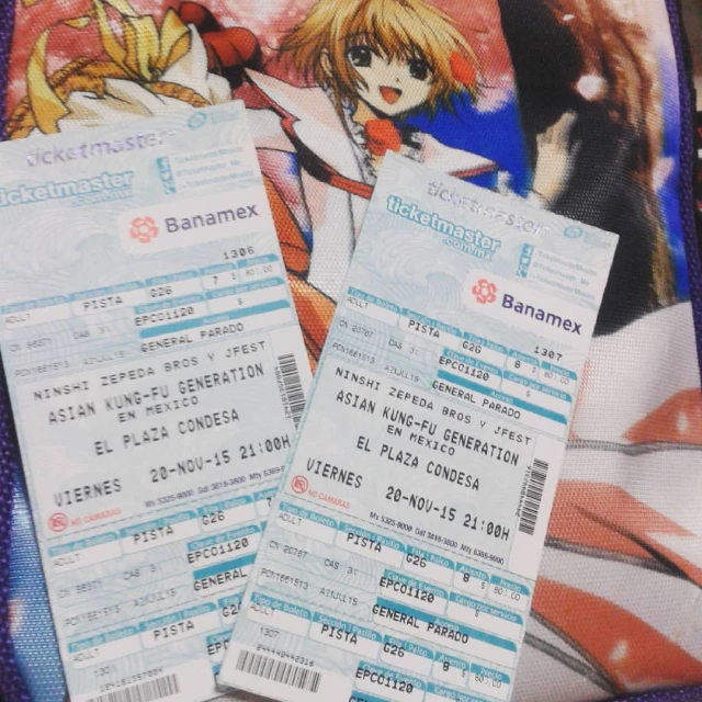 two paper tickets next to a cartoon character