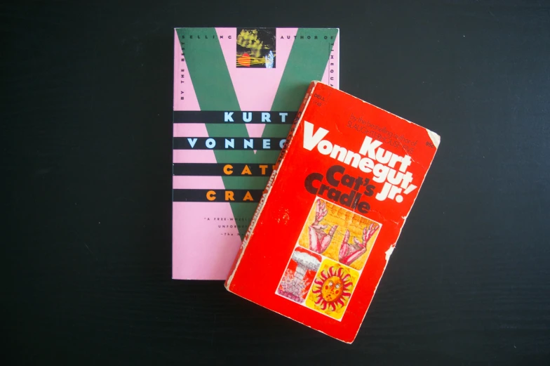 a books sit on a table, in the foreground is another book