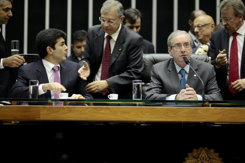 a group of men sitting next to each other