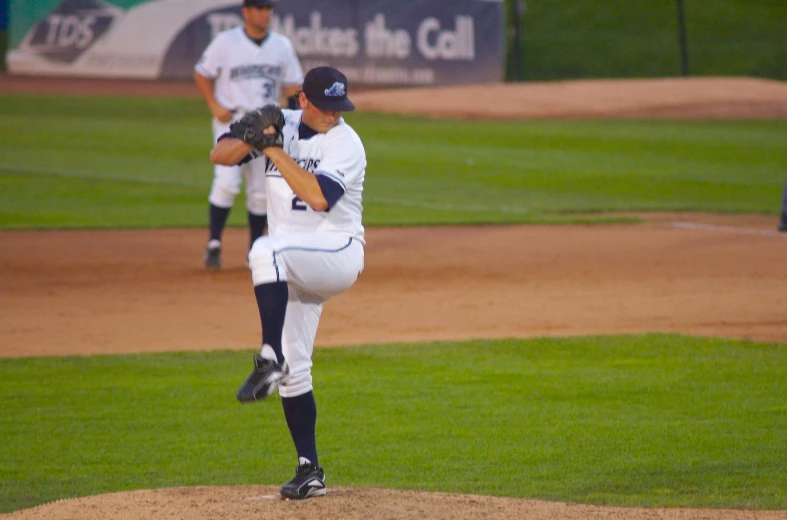 a pitcher in a baseball game throwing a pitch