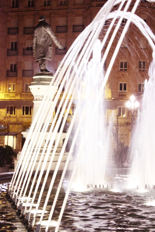 a large water fountain spewing water in the air