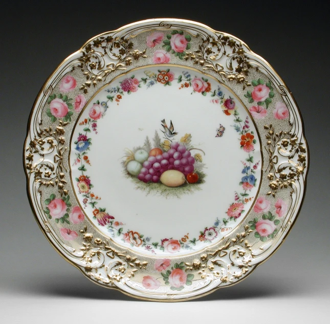 a colorful plate painted with birds and gs