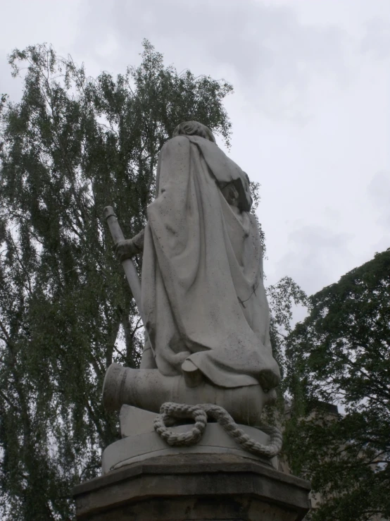 an old statue with no hands and dressed in robes