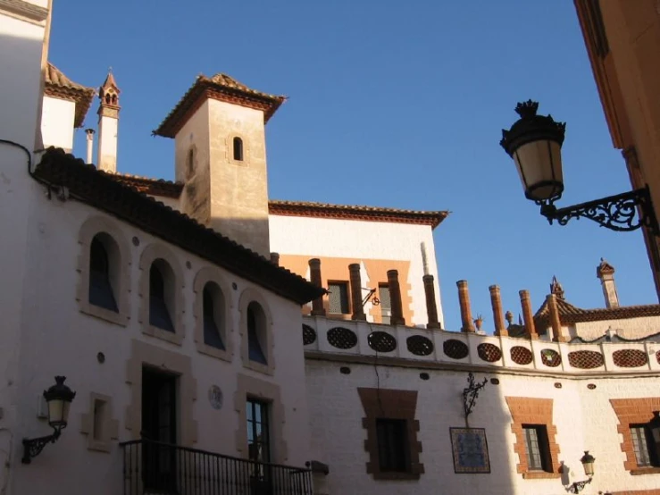 the exterior of an historic home under a sunny sky