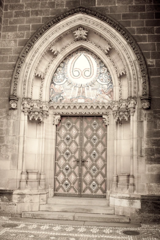 an ornate doorway with intricate designs on the doors