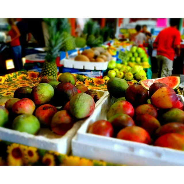 many different fruits are on display at a market