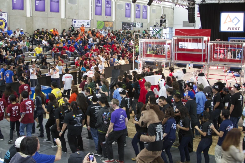 crowd of people outside building holding up signs