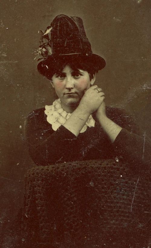 old fashioned picture of a young woman with her hand on her cheek