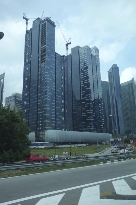 the city buildings are being demolished by cranes