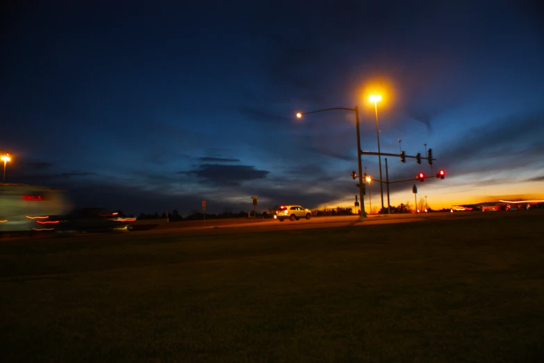 traffic lights on one street at the same time and dusk