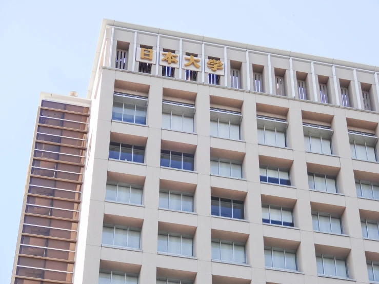 an apartment building with window openings and gold decorations