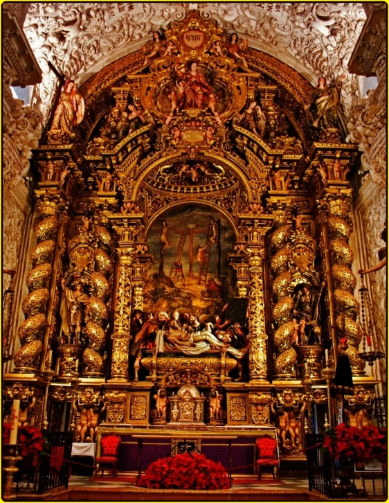 an ornate altar in an elaborate, gilded church