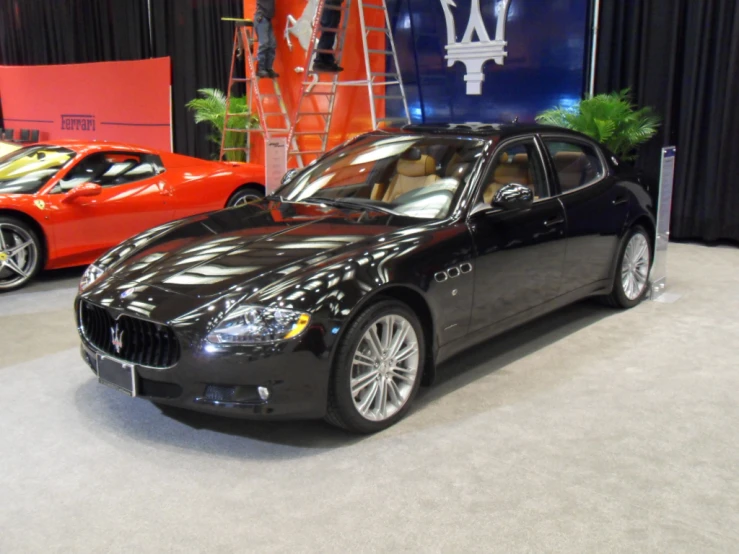 a car with the name alfa on it sitting on a stage