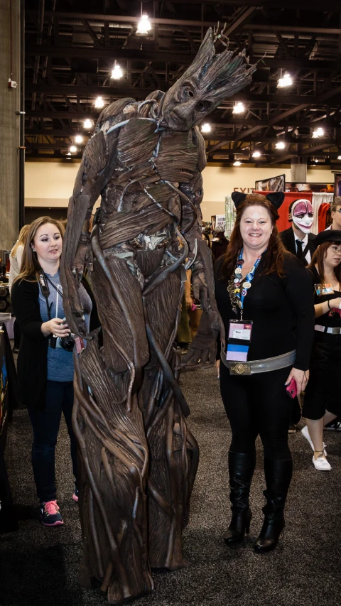 a man in a groote costume at a convention