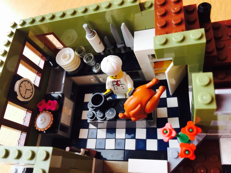 this room is made out of legos and has a turkey on the kitchen floor