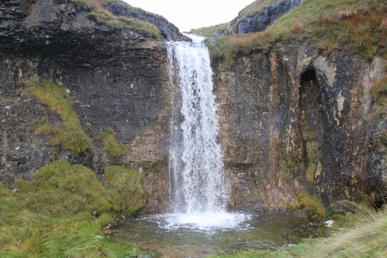 the waterfall has water running through it