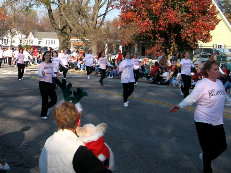 the people are running and jogging on the street