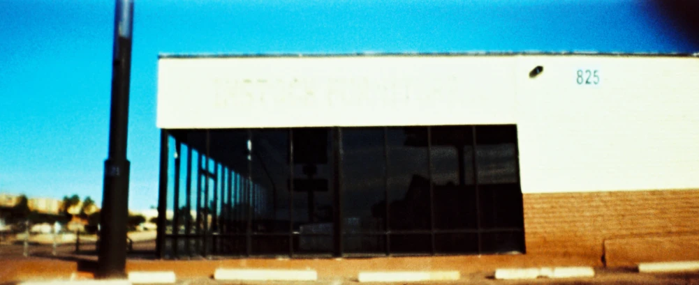 a street light with a building in the background