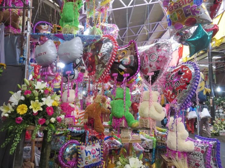 several colorful assortment of items are being sold in a market