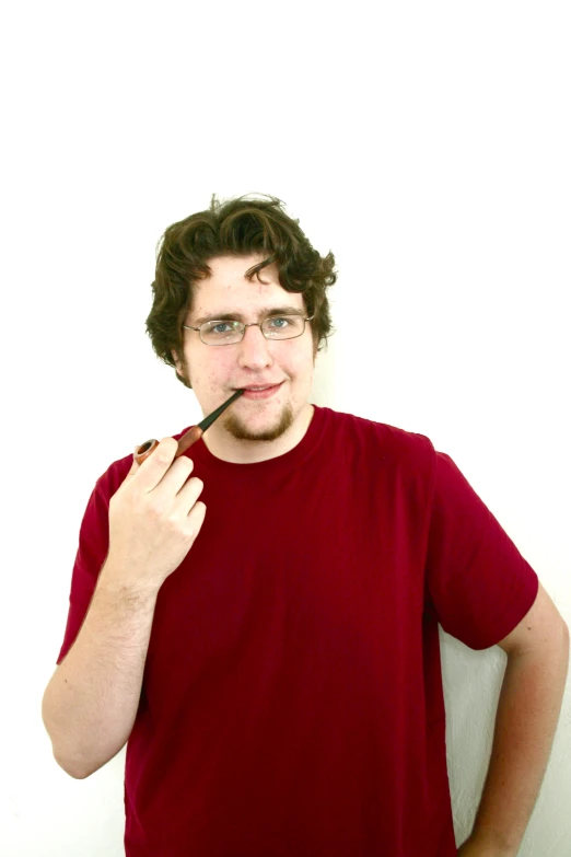a man posing with his eye glasses on