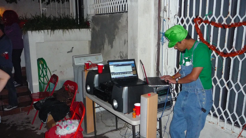 a man in a turban operates an electronic device