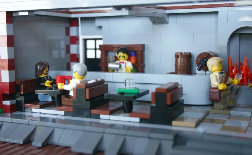 the scene is made out of legos with people on the set