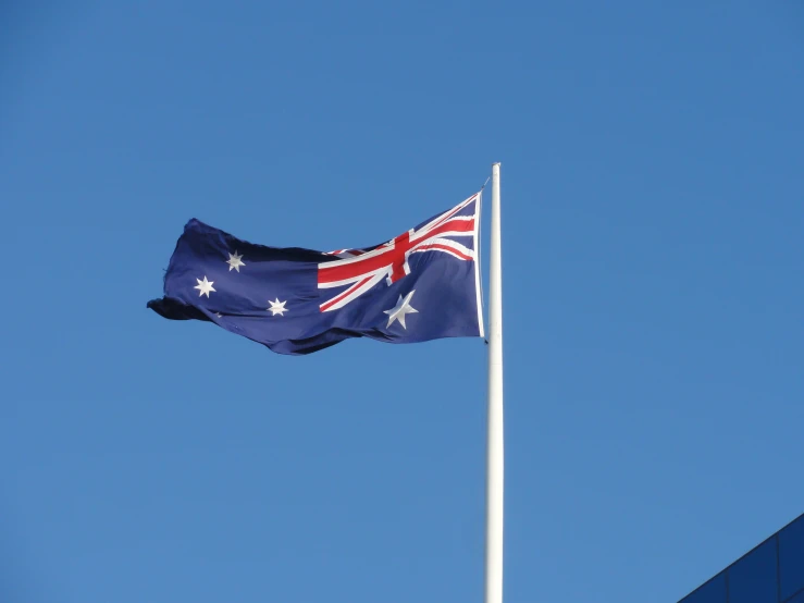 a flag is flying high on a pole