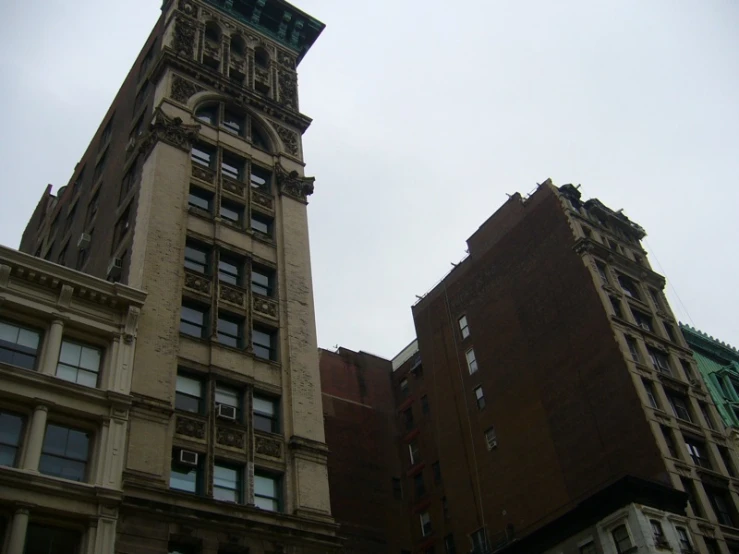 there are two buildings on the corner of this street