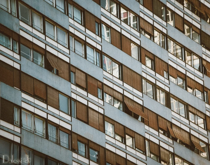 a building with windows and curtains in the windows