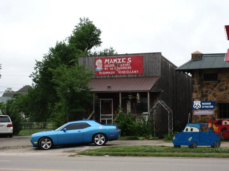 a car is parked in front of a little store