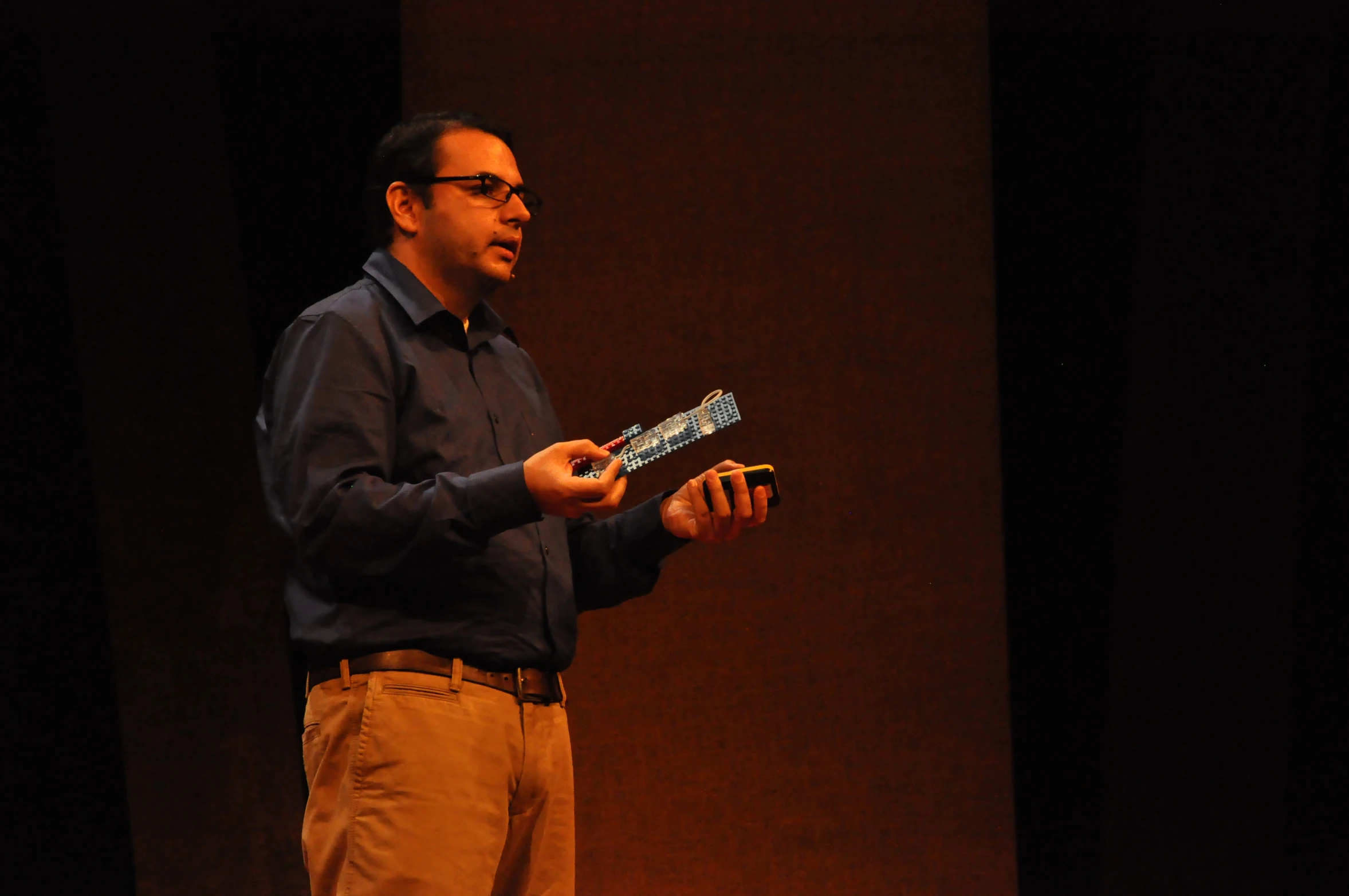 a man holding soing that he is in his hands