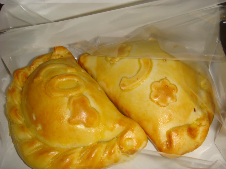 two baked bread pieces sit in a plastic bag