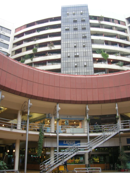 a view of a building in a city, from an open courtyard