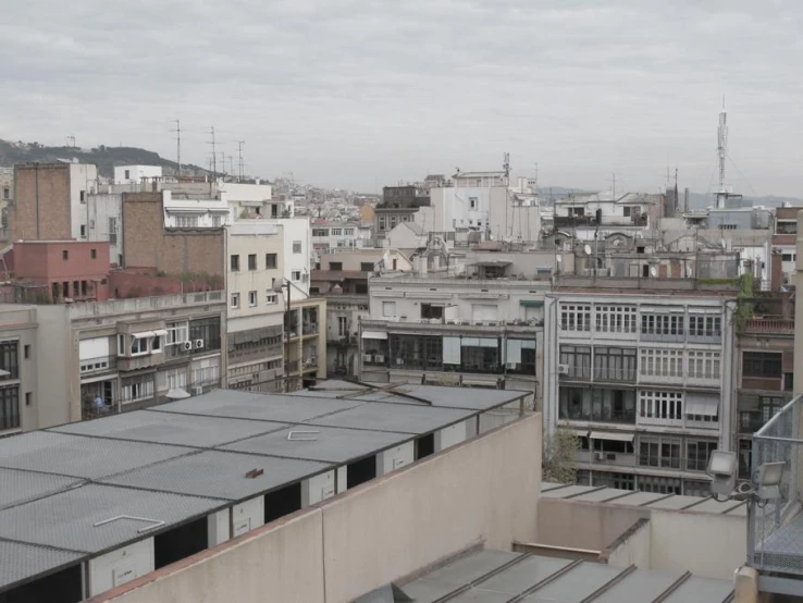 a large city skyline with some buildings and a roof