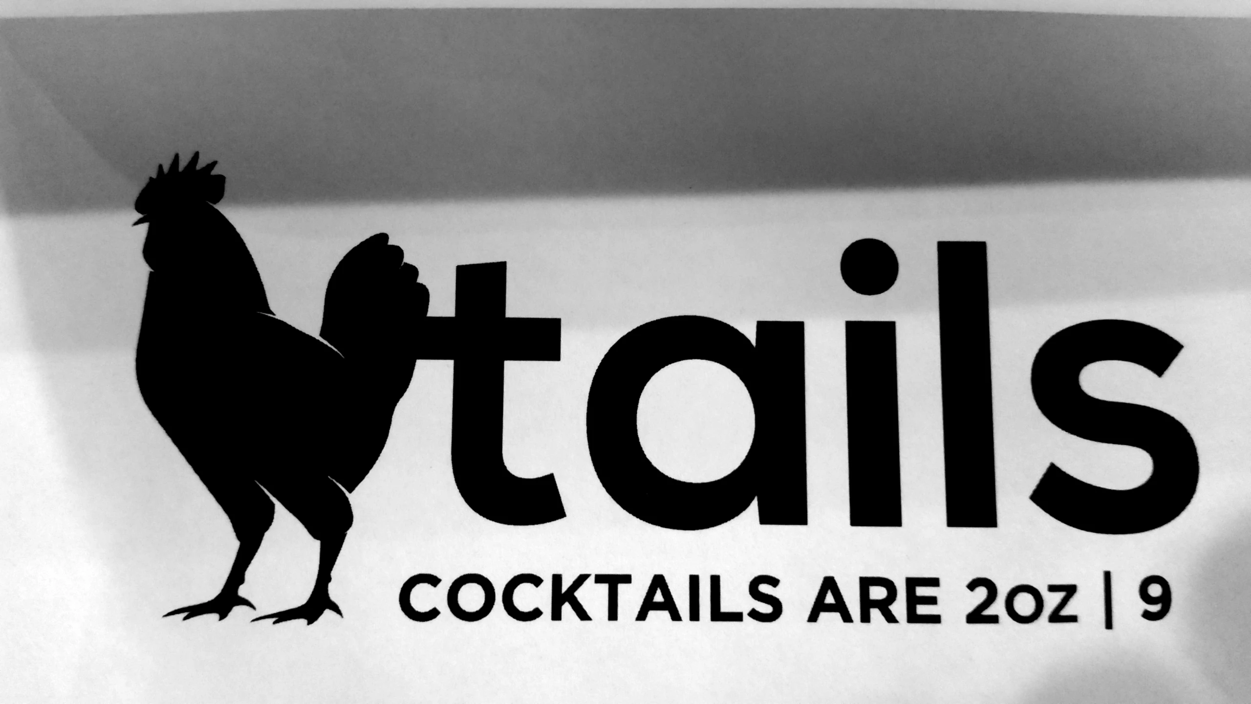 a close up of the logo of a cocktail