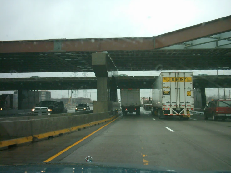 cars and trucks on an open highway heading for somewhere