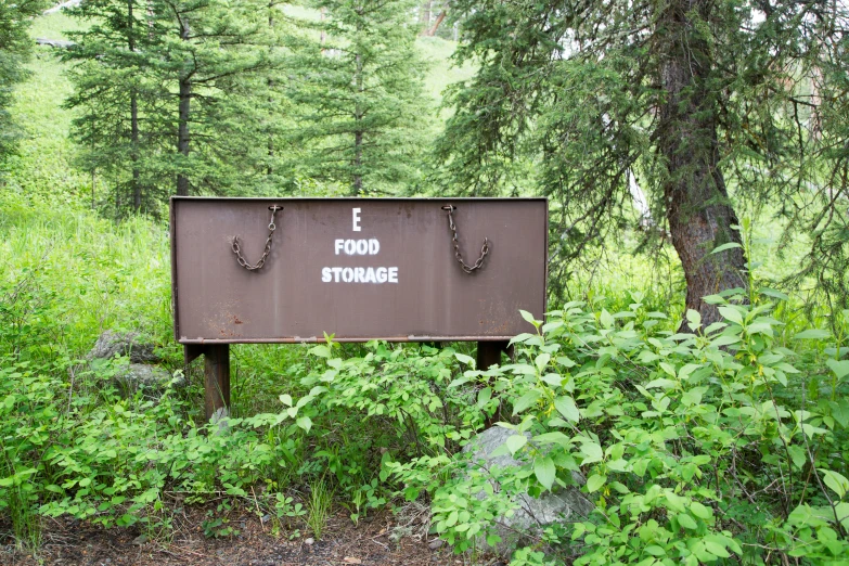 there is a sign in the wild about food storage