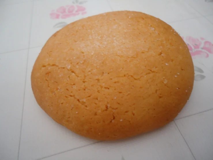 a round bread is sitting on top of a table