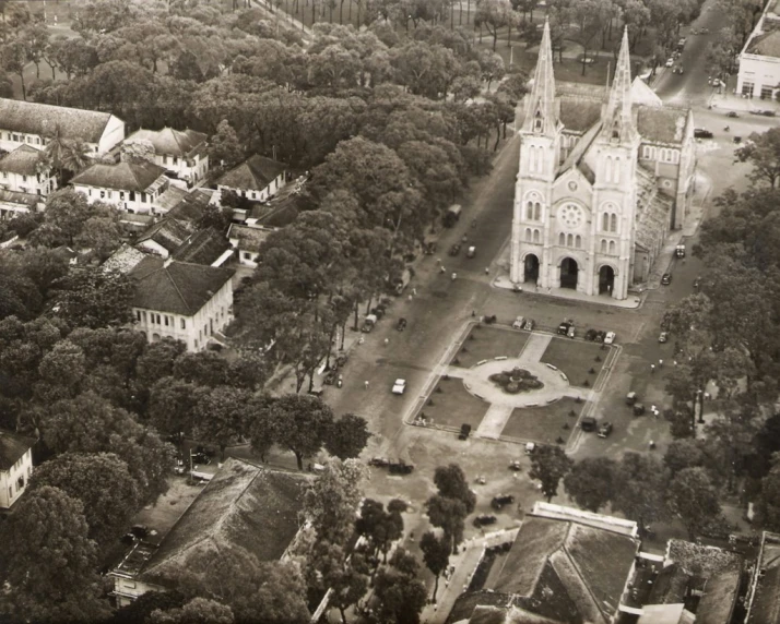 an old black and white po of a church and buildings