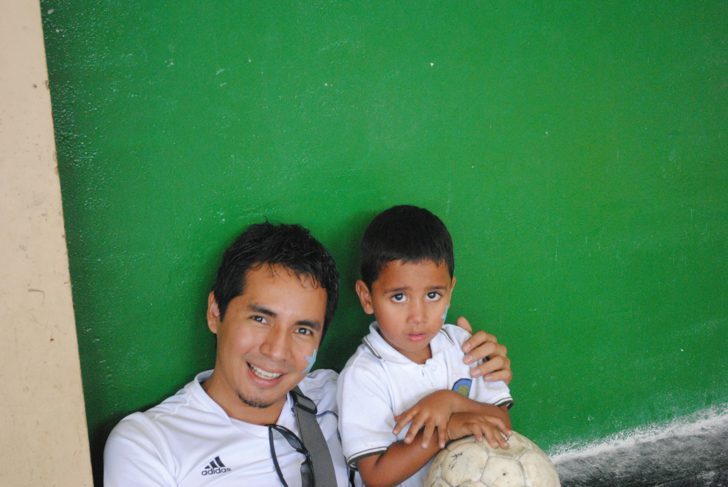 a young man and boy are posing for the camera