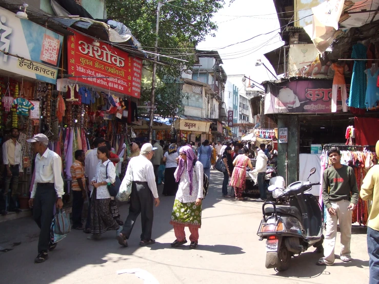 a crowded street filled with lots of people