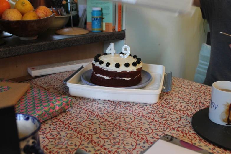 a white and brown cake sitting on top of a table