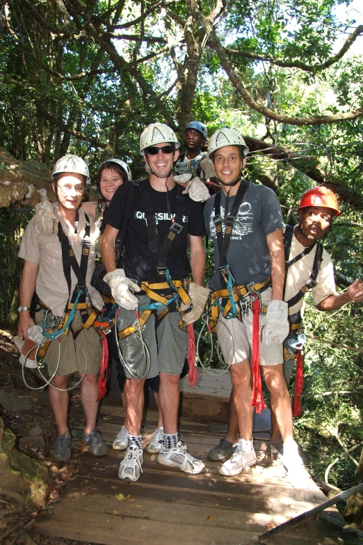 a group of people standing on a bridge