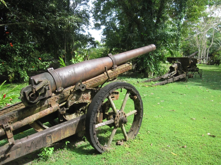 an old wooden cannon sitting on top of a field