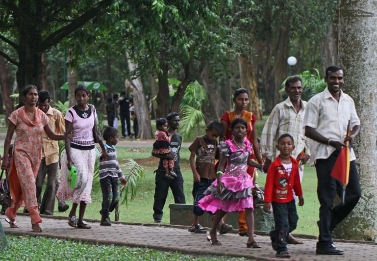 a small group of people walking down a path